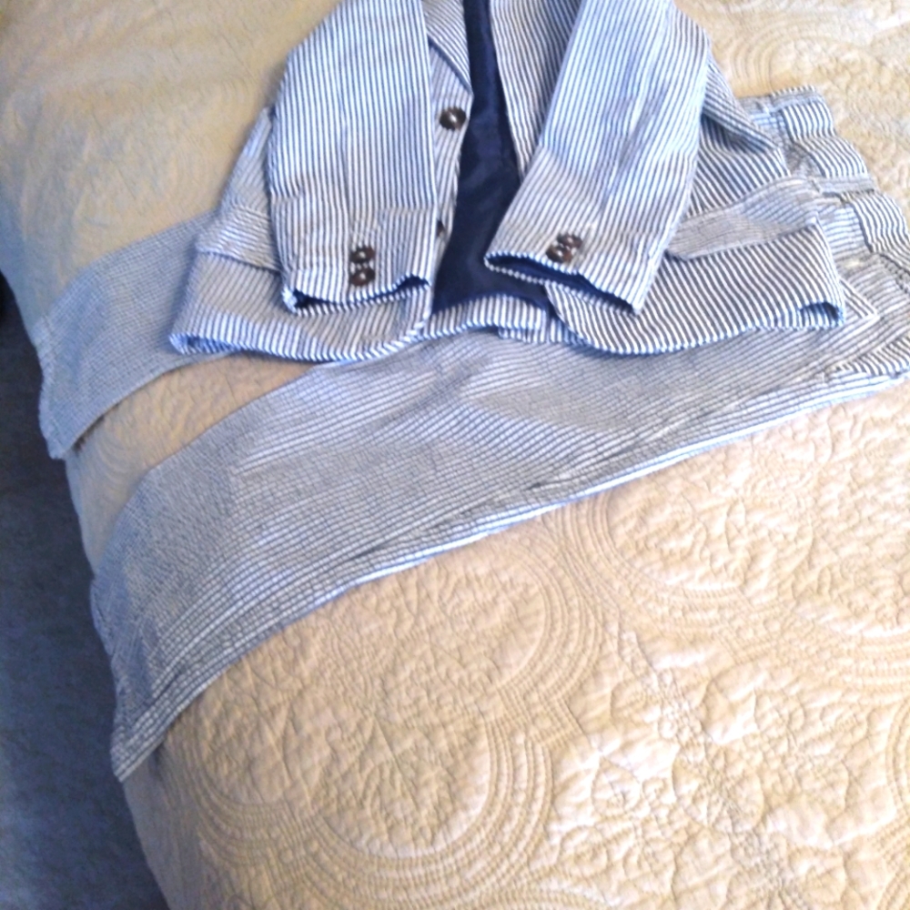 A young boy searsucker suit